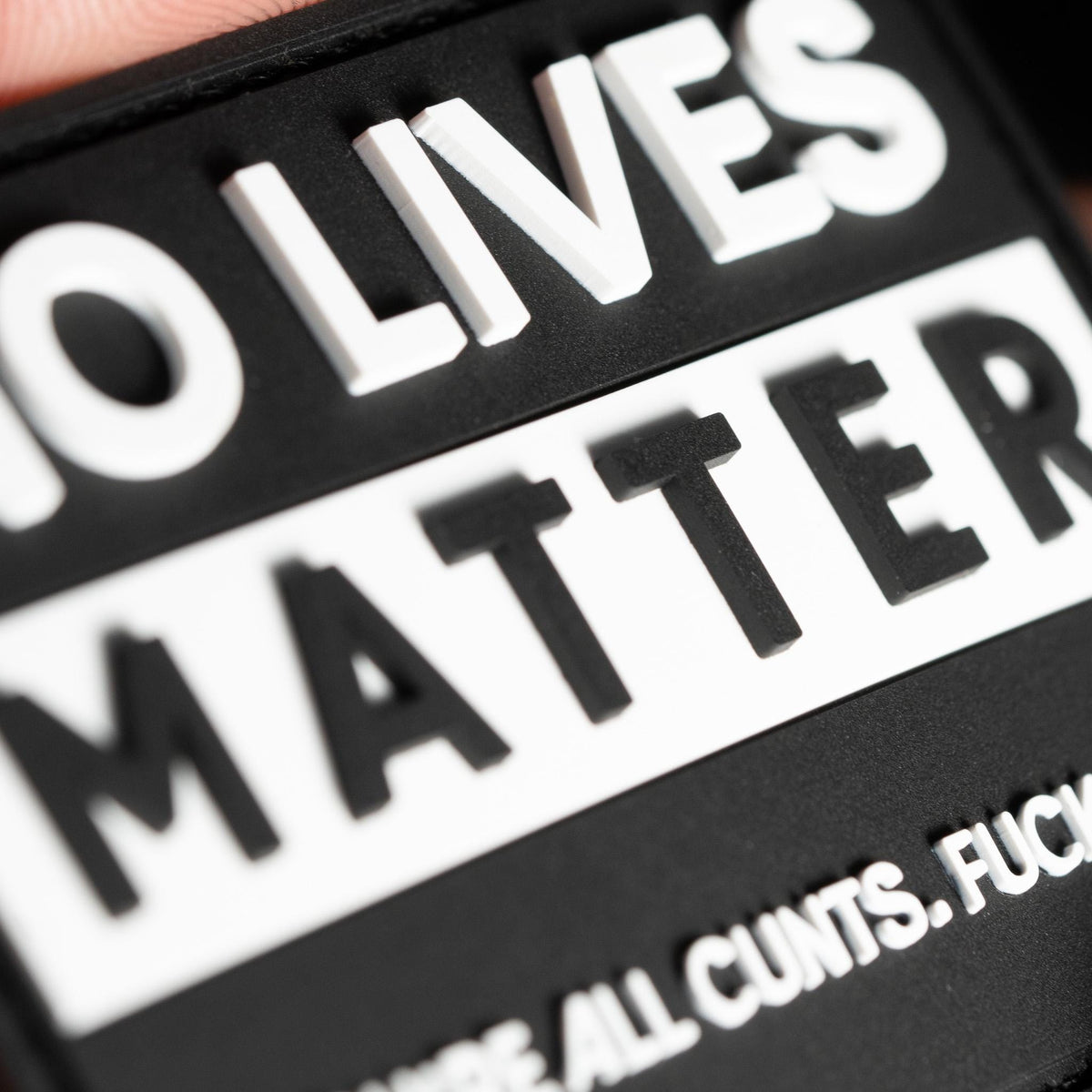 Close-up of No Lives Matter PVC morale patch with black-and-white quote design
