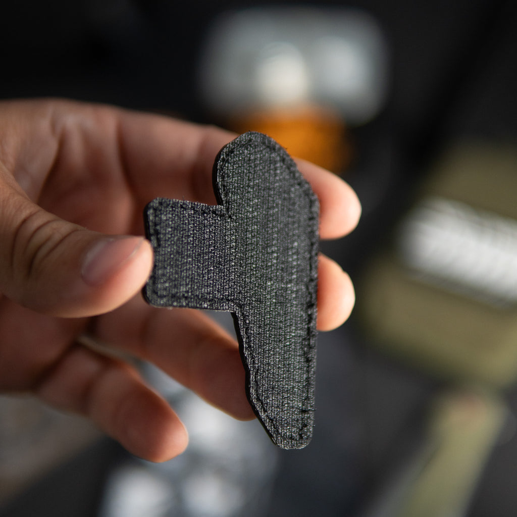 Back of I Saw That PVC morale patch showing black hook backing