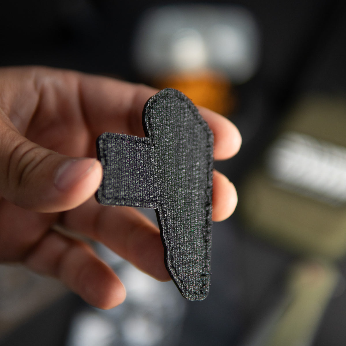 Back of I Saw That PVC morale patch showing black hook backing