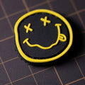 Nirvana PVC morale patch with black-and-yellow smiley design