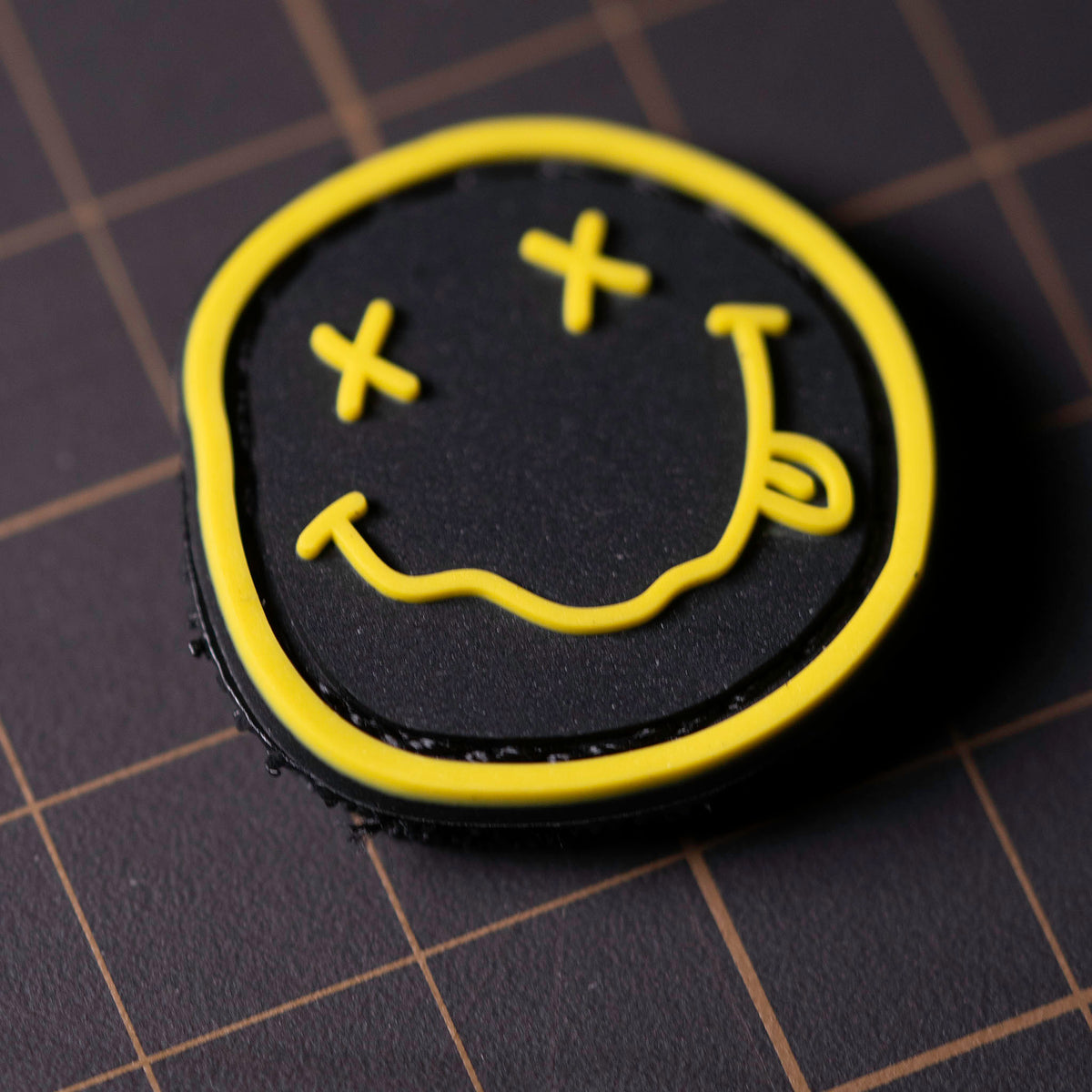 Nirvana PVC morale patch with black-and-yellow smiley design