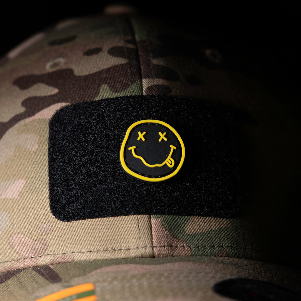 Nirvana PVC morale patch attached to a black patch panel