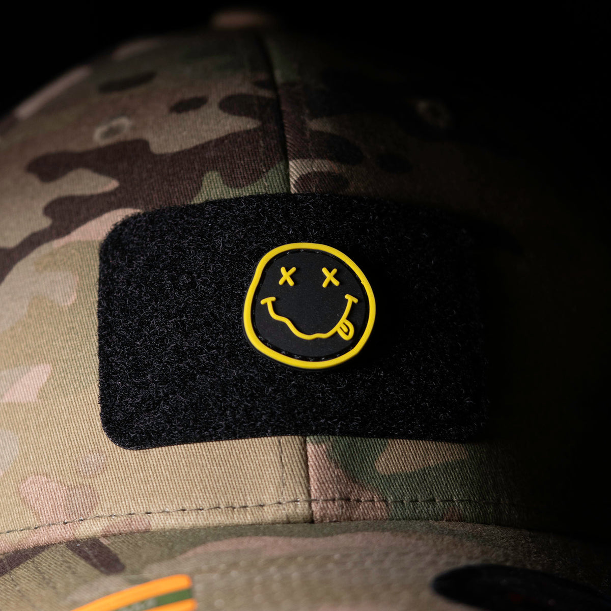 Nirvana PVC morale patch attached to a black patch panel