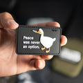 Peace Was Never an Option PVC morale patch with knife-wielding goose held in a hand