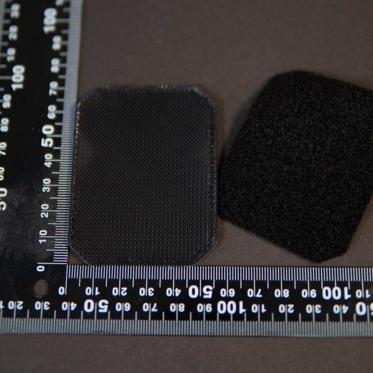 Back of Stay Rad PVC morale patch showing black hook backing