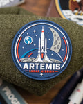 Artemis Lunar Mission PVC morale patch with rocket launch and moon design on tactical loop surface.
